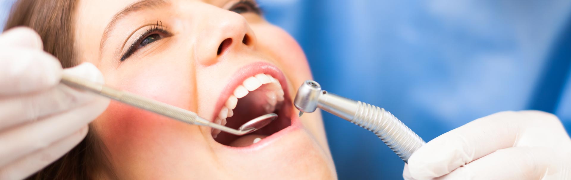 Woman having tooth colored fillings treatment